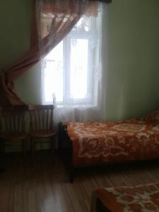 Postel nebo postele na pokoji v ubytování Mila Guest House