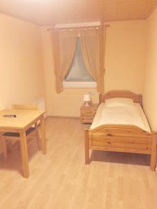 Ein Bett oder Betten in einem Zimmer der Unterkunft Hotel Restaurant Parthenon