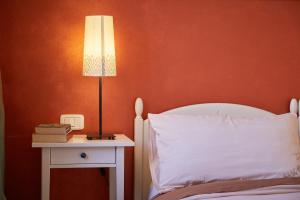 Postel nebo postele na pokoji v ubytování Cento Passi dal Duomo B&B