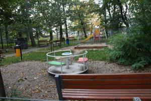 a park with a playground with a play equipment at Apartament Tabaco in Łódź