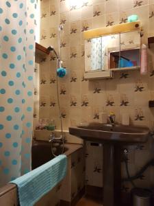 a bathroom with a sink and a shower at Apartament Tequila in Gdynia