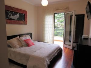 Llit o llits en una habitació de Apartment Villa Sol II