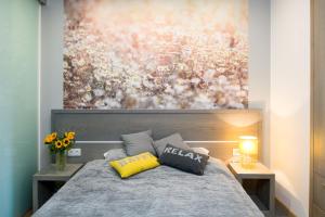 Posteľ alebo postele v izbe v ubytovaní Sunflower Apartment