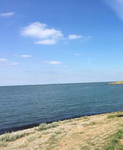 a view of a large body of water at Corona Laboris in Colijnsplaat