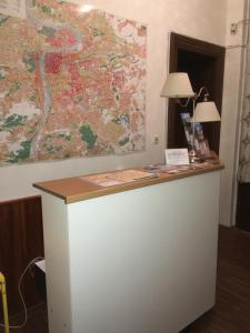 a counter with a map on the wall at Hostel EMMA in Prague