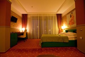 Postel nebo postele na pokoji v ubytování Road Star Hotel