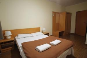 Postel nebo postele na pokoji v ubytování Hotel Miramar
