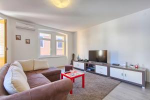 TV a/nebo společenská místnost v ubytování Apartment Spagnolo City