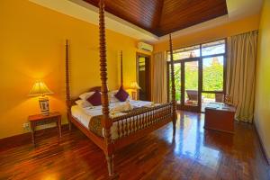 A bed or beds in a room at The Hotel @ Tharabar Gate