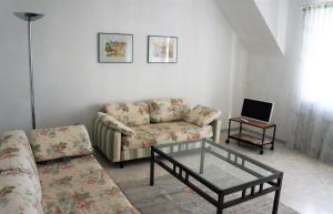 a living room with a couch and a coffee table at BodenSEE Apartment 1 - 4 Daisendorf bei Meersburg in Daisendorf