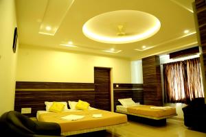 Samarth Residency客房内的一张或多张床位