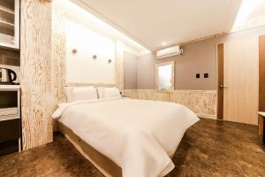Postel nebo postele na pokoji v ubytování Hotel TopsVille + 24 fotografií