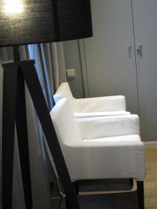 سرير أو أسرّة في غرفة في Hotel Alegria