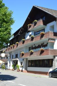 a building with a sign on the side of it at Alemannenhof Hotel Engel in Rickenbach