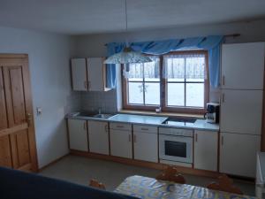 Kuchyň nebo kuchyňský kout v ubytování Obergarberhof