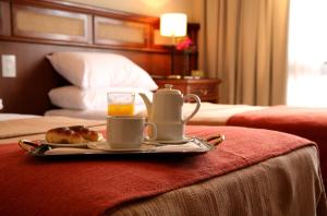 Cama ou camas em um quarto em Ayres De Salta Hotel
