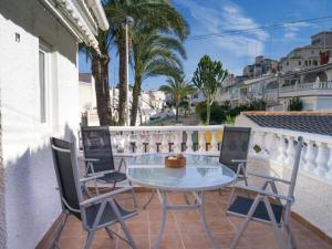 a patio with a table and chairs on a balcony at La Mata Apartments in Torrevieja