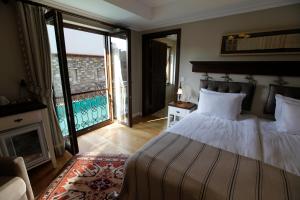 Säng eller sängar i ett rum på Akanthus Hotel Ephesus