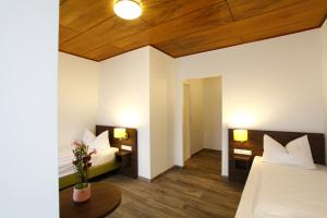 Postel nebo postele na pokoji v ubytování Arthotel ANA Eden