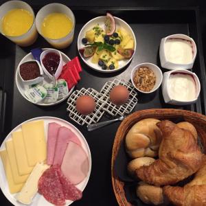 a table with many different types of food on it at B&B Suites FEEK in Antwerp