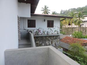 a view from the balcony of a house at Asantha Guest House in Unawatuna