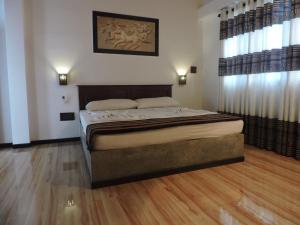Postel nebo postele na pokoji v ubytování Asantha Guest House