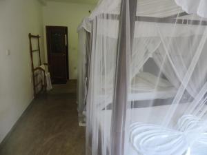 Postel nebo postele na pokoji v ubytování Asantha Guest House