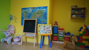 a room with a classroom with a chalkboard and toys at Prázdninové byty u kamaráta in Habovka