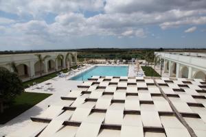 a view of the pool from the roof of a building at Agri Hotel Conte Salentino in Porto Cesareo