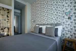 Postel nebo postele na pokoji v ubytování 15 Quindici by Serendipity Rooms