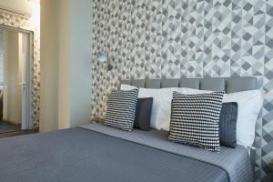 Postel nebo postele na pokoji v ubytování 15 Quindici by Serendipity Rooms