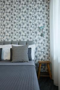 Postel nebo postele na pokoji v ubytování 15 Quindici by Serendipity Rooms