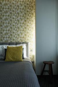 Postel nebo postele na pokoji v ubytování 15 Quindici by Serendipity Rooms