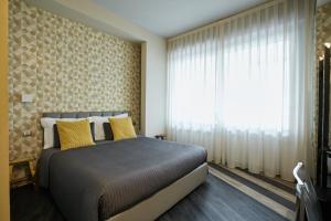 Postel nebo postele na pokoji v ubytování 15 Quindici by Serendipity Rooms