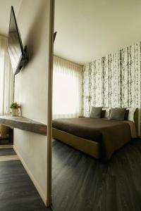 Postel nebo postele na pokoji v ubytování 15 Quindici by Serendipity Rooms