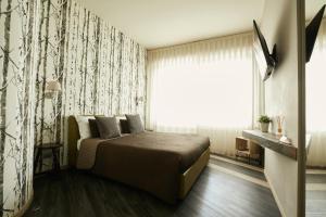 Postel nebo postele na pokoji v ubytování 15 Quindici by Serendipity Rooms