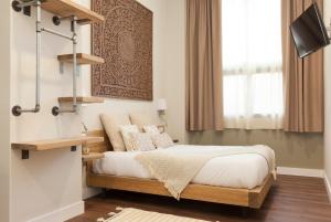 מיטה או מיטות בחדר ב-Hotel Radha