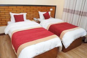 Letto o letti in una camera di Hotel Bagmati