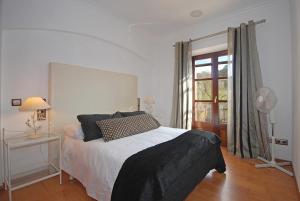 A bed or beds in a room at Villa Canova