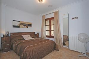 A bed or beds in a room at Villa Canova