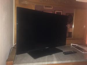 TV a/nebo společenská místnost v ubytování L'angolo antico