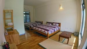 A bed or beds in a room at Hoka in Sanyi
