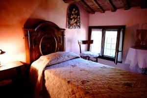 Ένα ή περισσότερα κρεβάτια σε δωμάτιο στο Agriturismo la Strozza