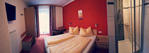 Postel nebo postele na pokoji v ubytování Hotel Pension Oswald