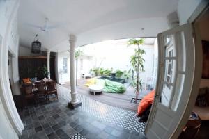 a living room with a view of a living room at The Patio Yogya in Yogyakarta