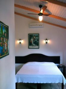 Ένα ή περισσότερα κρεβάτια σε δωμάτιο στο Pousada Pouso do Frade