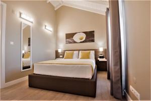 Quinta do Basalto tesisinde bir odada yatak veya yataklar