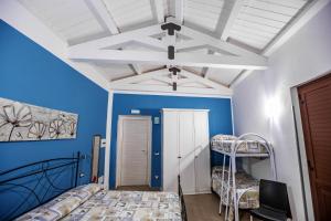 a room with two bunk beds and a ceiling at B&B Acquachiara in Roccella Ionica