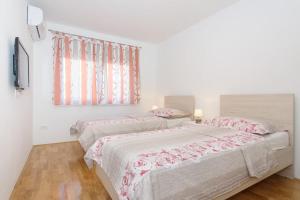 Posteľ alebo postele v izbe v ubytovaní Apartment Kate