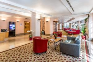 a lobby with couches and chairs and a table at Washington Mayfair Hotel in London